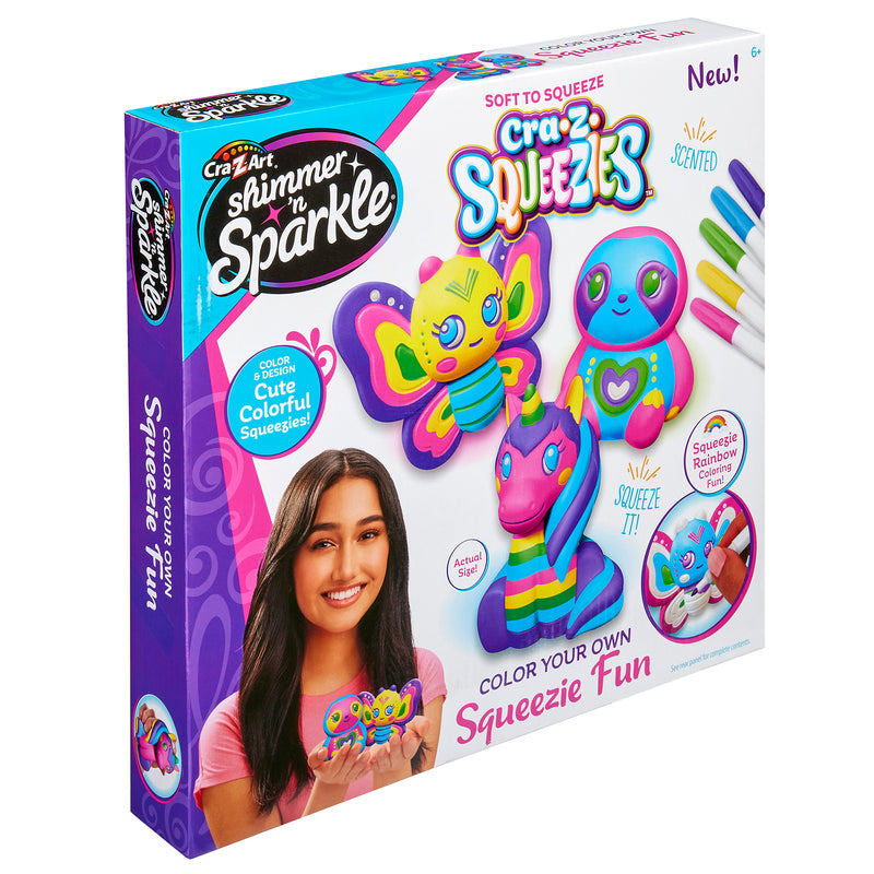 A Shimmer 'n Sparkle Cra-Z-Squeezies Color Your Own Squeezie Fun box showcasing colorful, squeezable toys. The set includes markers for coloring and features a girl holding a decorated toy on the packaging.