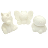 Three unpainted, white Shimmer 'n Sparkle Cra-Z-Squeezies Color Your Own Squeezie Fun figurines featuring a unicorn, a butterfly, and an owl, each with a cute cartoonish design and detailed features.