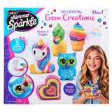 A box of Shimmer 'n Sparkle 3 D Crystal Gem Creations, showing various colorful gem-covered models, including a unicorn, owl, ice cream, and rainbow heart. A girl smiles holding the rainbow heart.