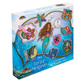 A boxed craft kit for making The Little Mermaid 2 in 1 Window Set. The kit includes 8 sun catchers to paint and display and is designed for ages 6 and up.