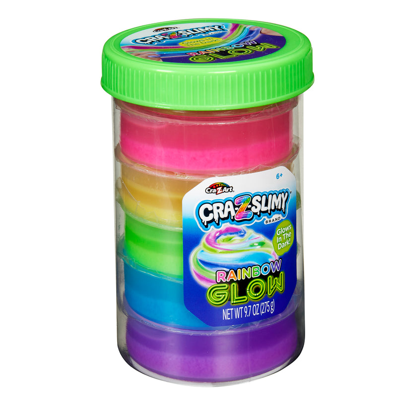 A clear cylindrical container with a green lid holds six different colors of Cra-Z-Slimy Glow Slimy Jar. The label on the front indicates the slime glows in the dark and has a net weight of 9.7 oz (275 g).