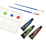A RoseArt Premium ACRYLIC PAINT SET 30 Count with red, blue, and green paint, two paintbrushes with blue handles, and three paint tubes: blue, green, and red.