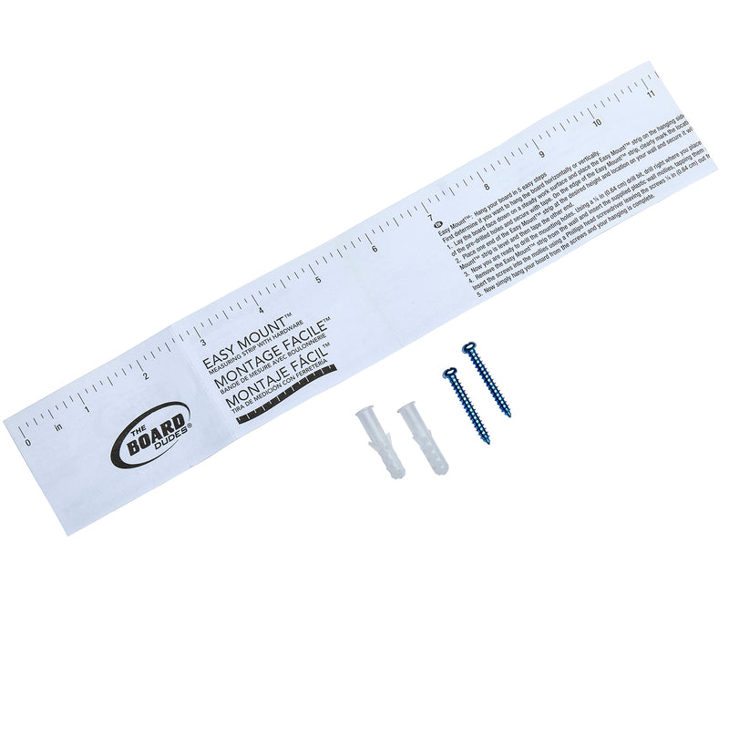 A white paper ruler labeled "Board Dudes Combo Board Distressed Wood 17x23 INCH," with instructions in multiple languages. Two plastic wall anchors and two metal screws are placed next to the ruler.
