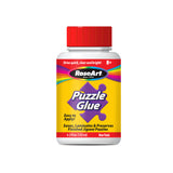 A bottle of RoseArt - Puzzle Glue - 4.5 ozs with a red cap. The label states it is non-toxic, easy to apply, dries quick, clear, and bright, suitable for ages 8 and up, and is used to save, laminate, and preserve jigsaw puzzles.
