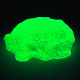 Cra-Z Sand Glow glowing against a dark background.