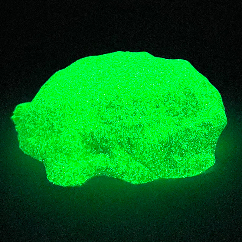 Cra-Z Sand Glow glowing against a dark background.