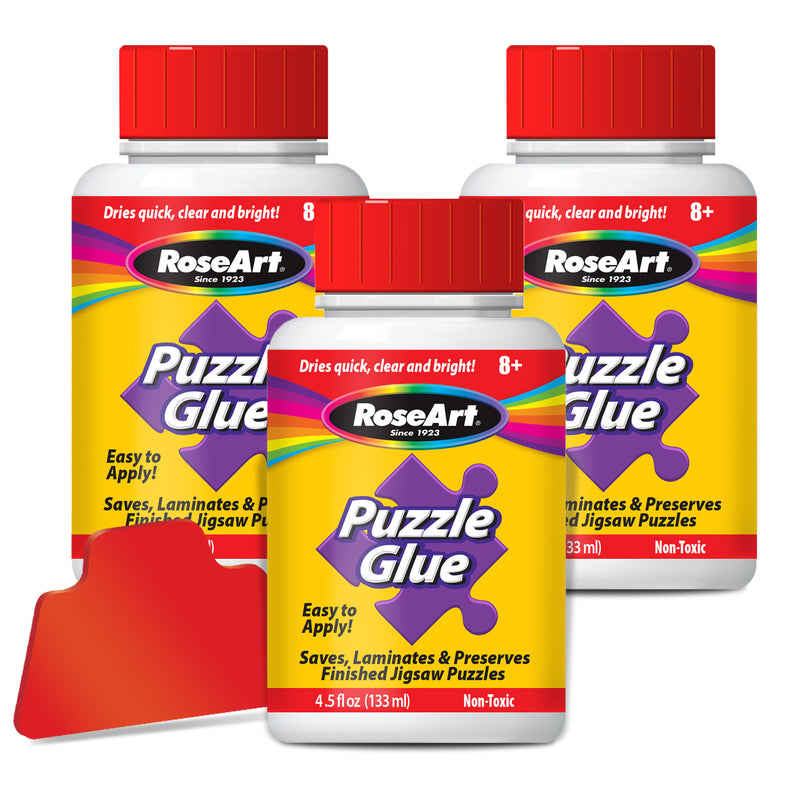 Three bottles of RoseArt - 4.5 oz Puzzle Glue 3 pack with red screw-on caps and labels that read, "Puzzle Glue" and "Saves, Laminates & Preserves Finished Jigsaw Puzzles." One red glue spreader is also shown.