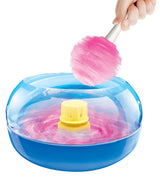 A person is making pink cotton candy using The Real Cotton Candy Maker.