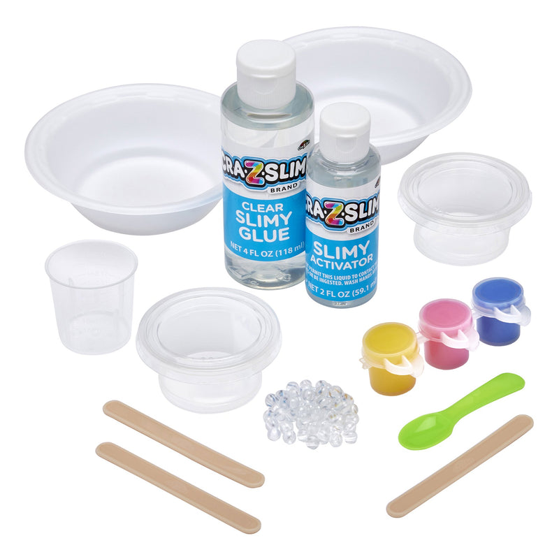 Contents of Cra-Z-Slimy Crunchy Pop DIY scented slime kit out of box with clear slime glue, activator, colorants, crunchy beads, mixing tools, cups, and bowls for kids ages 6+.