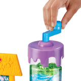 A hand turns the blue crank on top of the purple lid attached to the Stitch Slime Studio cylindrical container with a water-themed design.
