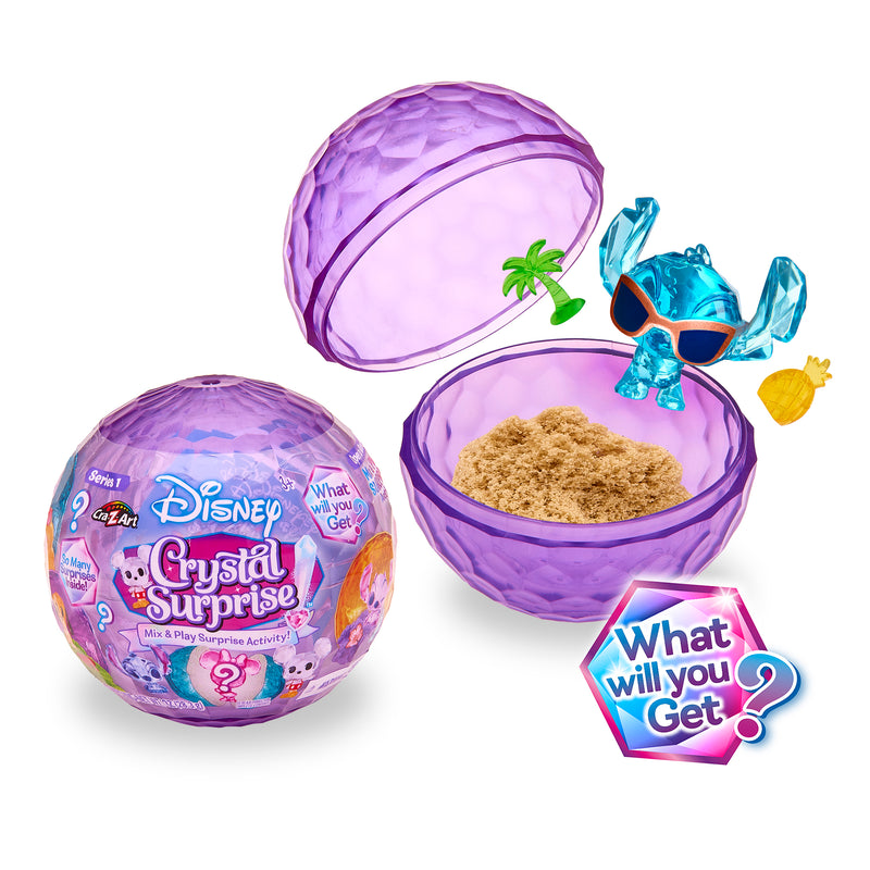 The Disney Crystal Surprise Color Change Ball, available in a vibrant purple hue, opens to unveil magical sand, a mini palm tree, a pineapple, and a small color-changing blue figurine with sunglasses. The packaging intriguingly prompts, "What will you get?