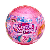The Disney Crystal Surprise Color Change Ball is packaged in a pink spherical container embellished with inviting phrases, question marks, and a touch of magical color change, offering an exciting mystery inside.